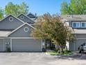 Charming two-story home with a well-manicured front yard, complemented by a cozy two-car garage at 5006 S Nelson St # B, Littleton, CO 80127