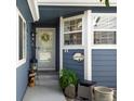 Inviting front entrance with charming details, including a decorative wreath and welcoming decor at 5006 S Nelson St # B, Littleton, CO 80127