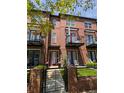 Stunning brick townhome with multiple balconies and landscaped entryway at 4181 W 118Th Pl, Westminster, CO 80031