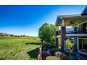 A spacious second-story porch with a great view of the surrounding, well-manicured, green spaces at 22685 E Calhoun Pl, Aurora, CO 80016