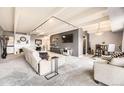 Comfortable living room with a large sectional, recessed lights, and modern decor at 7865 E Mississippi Ave # 602, Denver, CO 80247