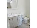 Well-lit bathroom with a white vanity and a modern toilet at 12225 E 2Nd Dr, Aurora, CO 80011