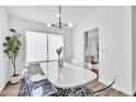 Bright dining area featuring modern lighting and stylish transparent chairs at 16332 Bluebell Pl, Parker, CO 80134