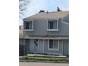 This townhome boasts a freshly painted exterior with white trim and a welcoming front entrance at 8791 Chase Dr # 220, Arvada, CO 80003