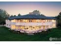 Stunning exterior of unique house design with multiple windows and curved patio at 640 S 68Th St, Boulder, CO 80303