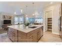 Modern kitchen island with white quartz countertops at 1765 Peak Loop, Broomfield, CO 80023
