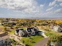 Luxury home aerial view showcasing expansive property and neighborhood at 6816 Goldbranch Dr, Niwot, CO 80503