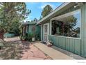 Charming exterior featuring a stone walkway, well-manicured landscaping, and a welcoming entrance at 107 Deer Trail Rd, Boulder, CO 80302