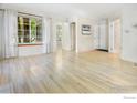 Bright living room featuring light wood floors and large windows at 4837 White Rock Cir # G, Boulder, CO 80301