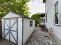 Outdoor space featuring a storage shed, patio and a built in fire pit at 2720 E 121St Pl, Thornton, CO 80241