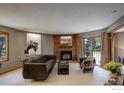 Charming living room with a fireplace, comfortable seating, and access to the outdoors, offering a relaxing retreat at 2962 Shadow Creek Dr # 109, Boulder, CO 80303