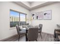 Bright dining area with a glass table, seating for four, and large window, perfect for entertaining at 2445 Junction Pl # 206, Boulder, CO 80301