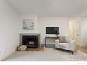 Inviting living room features a fireplace, a television, and a cozy seating area at 665 Manhattan Dr # 5, Boulder, CO 80303