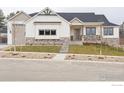 Charming single-Gathering home with stone accents and a well-manicured lawn, creating an inviting curb appeal at 1361 Art Dr, Berthoud, CO 80513
