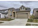 Inviting two-story home showcasing stone accents, a two-car garage, and well-maintained front yard at 3140 Newfound Lake Rd, Berthoud, CO 80513