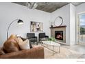 Living room features a fireplace and access to balcony at 3401 Arapahoe Ave # 218, Boulder, CO 80303