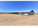 Exterior view of a large barn on a spacious, rural property at 11499 County Road 40.5, Platteville, CO 80651