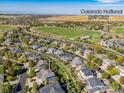 Aerial view of a beautiful home near the Colorado National Golf Club, showcasing the surrounding community at 2841 Ironwood Cir, Erie, CO 80516