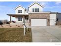 Stunning two-story home with brick and siding exterior at 1426 Swan Peter Dr, Berthoud, CO 80513