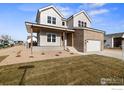 Two-story home with charming farmhouse style exterior at 1426 Swan Peter Dr, Berthoud, CO 80513