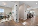 Bright home office with hardwood floors and natural light at 1426 Swan Peter Dr, Berthoud, CO 80513