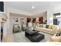 Open living room with a view of the kitchen and ample seating at 704 Windflower Dr, Longmont, CO 80504