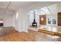 Spacious living area with hardwood floors, exposed brick, and a fireplace at 2238 15Th St, Boulder, CO 80302