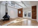 Bright living room featuring hardwood floors, exposed brick, and a modern fireplace at 2238 15Th St, Boulder, CO 80302