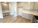 Stylish kitchen featuring wood-look flooring and durable countertops at 2277 Serenidad St, Brighton, CO 80601