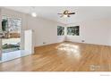 Bright, airy living room with hardwood floors and large windows offering scenic views at 3125 20Th St, Boulder, CO 80304