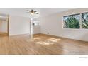 Spacious living room featuring hardwood floors and natural light from a large window at 3125 20Th St, Boulder, CO 80304