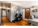 Bright entryway with hardwood floors, and a view into the living room at 1418 Sunset St, Longmont, CO 80501