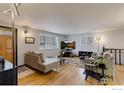 Spacious living room featuring hardwood floors, neutral walls and ample natural light at 1418 Sunset St, Longmont, CO 80501