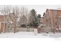 Townhomes in snowy neighborhood with trees and mailboxes at 4110 Riley Dr, Longmont, CO 80503