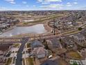 Property view showcasing home, golf course, and lake at 7690 S Blackstone Pkwy, Aurora, CO 80016