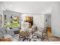 Sunlit living room seamlessly blends with the kitchen, offering open-concept living and dining at 3035 Oneal Pkwy # 21, Boulder, CO 80301