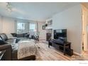 Spacious living room featuring a fireplace and comfortable seating at 8093 Miller Cir, Arvada, CO 80005