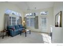 Sunlit living room showcasing a comfortable teal sofa at 10710 Eliot Cir # 101, Westminster, CO 80234