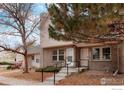 Traditional brick townhome with well-maintained landscaping and inviting front entrance at 3040 W 107Th Pl # B, Westminster, CO 80031