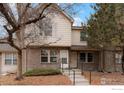 Traditional brick townhome with well-maintained landscaping and inviting front entrance at 3040 W 107Th Pl # B, Westminster, CO 80031