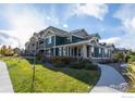 Two-story home with green exterior and landscaping at 509 Brennan Cir, Erie, CO 80516