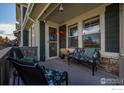 Relaxing front porch with seating for two at 509 Brennan Cir, Erie, CO 80516