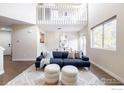 Spacious living room with high ceilings and comfortable seating at 6158 Habitat Dr, Boulder, CO 80301