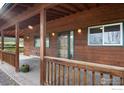 Inviting home with a wooden porch and charming details at 12645 Foothills Hwy, Longmont, CO 80503