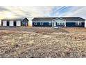 Ranch-style home with attached garage and expansive yard at 17913 County Road 38, Platteville, CO 80651