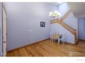 Small dining area with hardwood floors and a view of the staircase at 2081 N Fork Dr, Lafayette, CO 80026