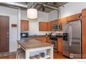 Updated kitchen featuring an island and stainless steel appliances at 3701 Arapahoe Ave # 317, Boulder, CO 80303