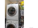 Stackable washer and dryer in a small laundry closet at 3701 Arapahoe Ave # 317, Boulder, CO 80303