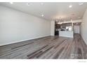 Spacious living room with hardwood floors and open floor plan at 410 High Point Dr # 103, Longmont, CO 80504