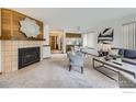 Living room with a fireplace and an open floor plan at 4648 Chestnut Ln, Boulder, CO 80301
